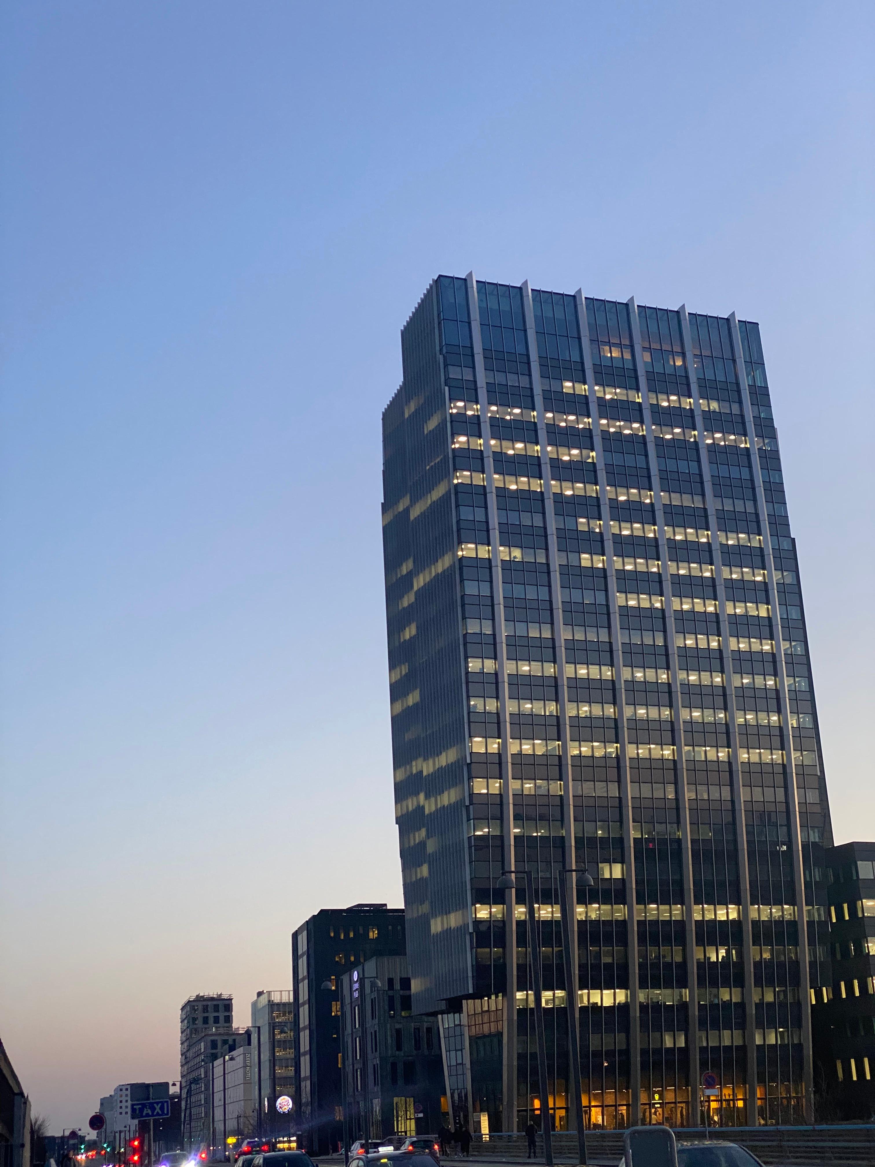 Modern glass skyscraper towers at dusk
