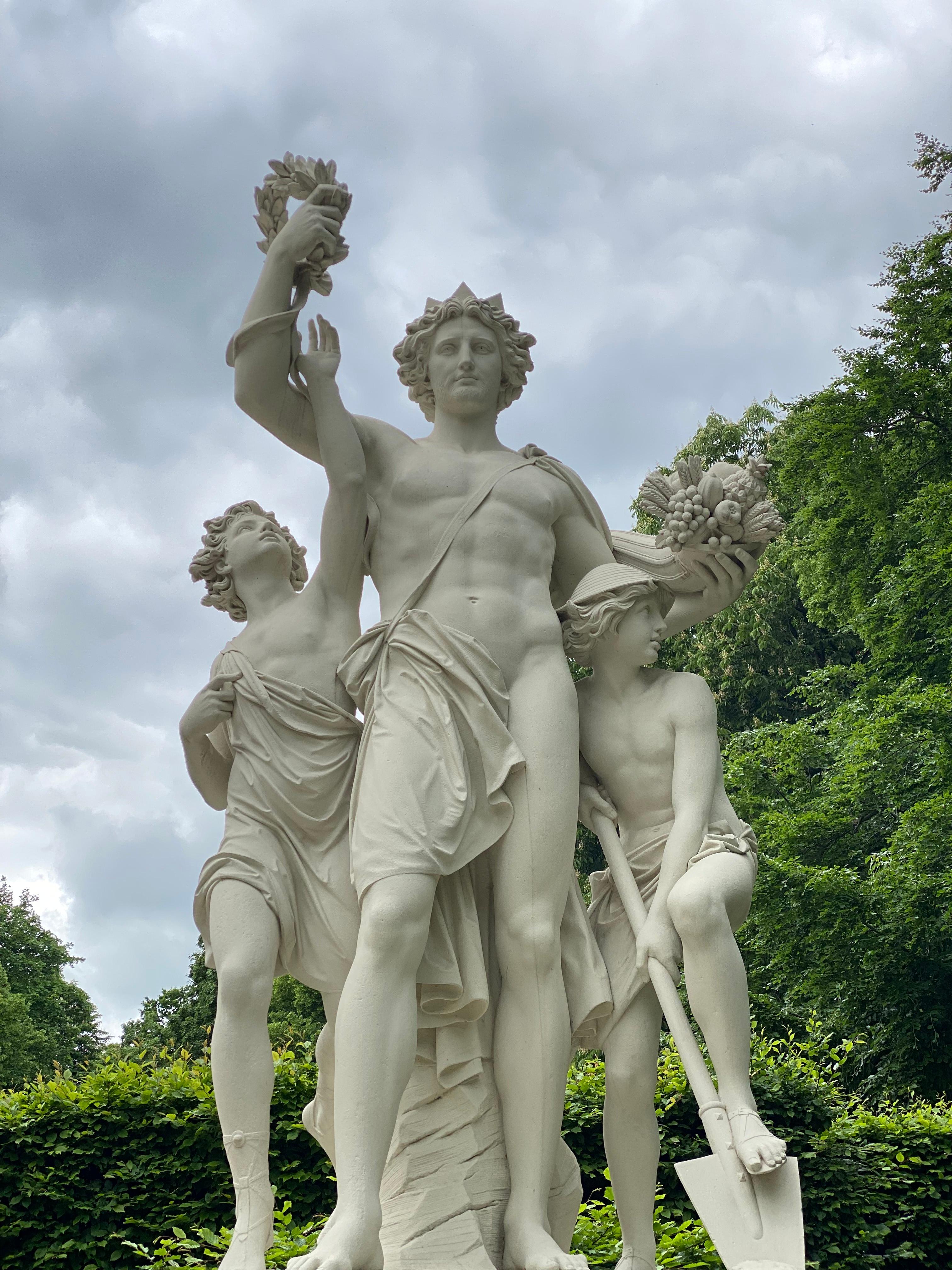 Classical marble statues in a garden