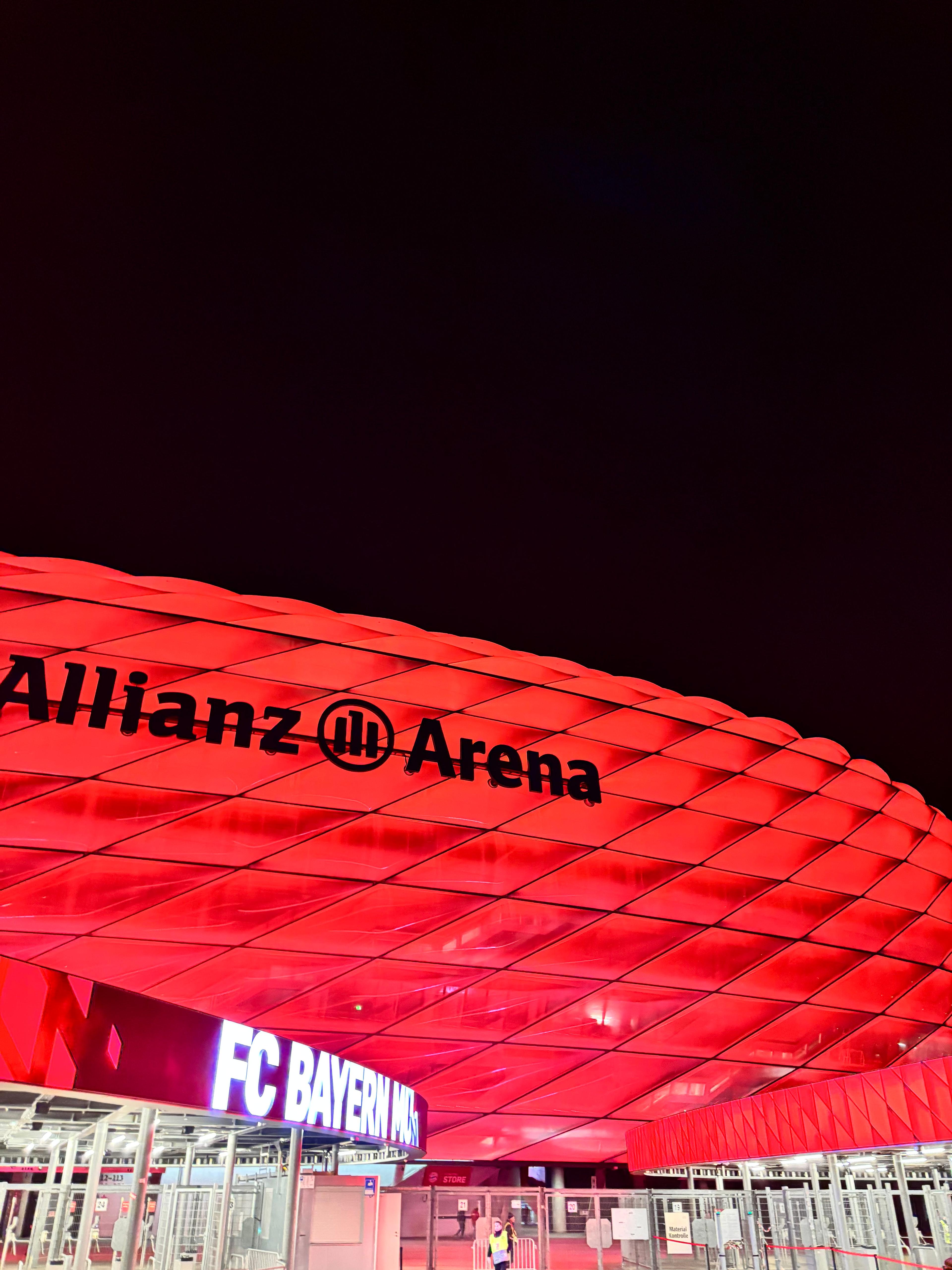 Allianz Arena glowing red at night