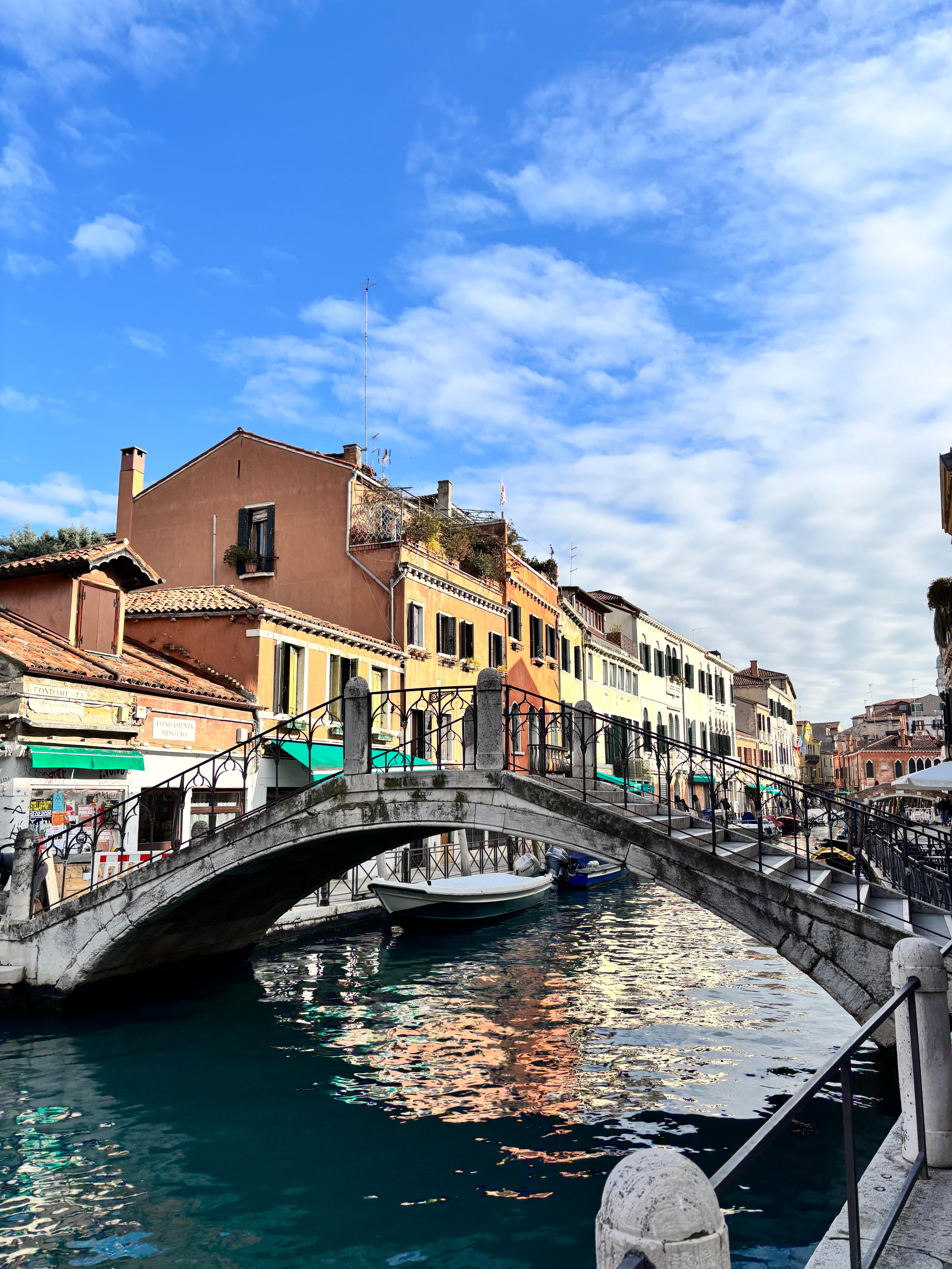 Venice Grand Canal with gondola and colourful buildings