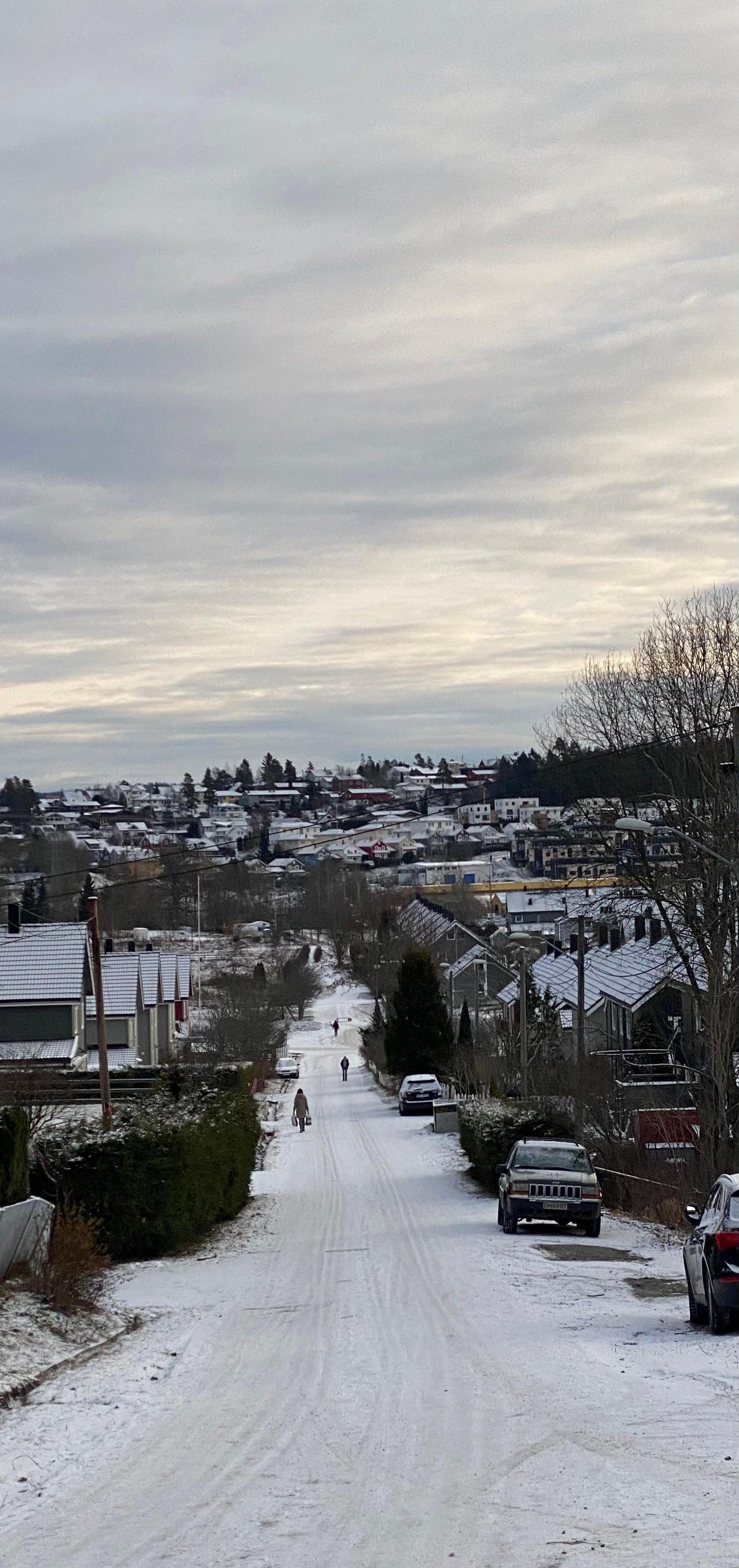 Snow-covered residential street in Oslo