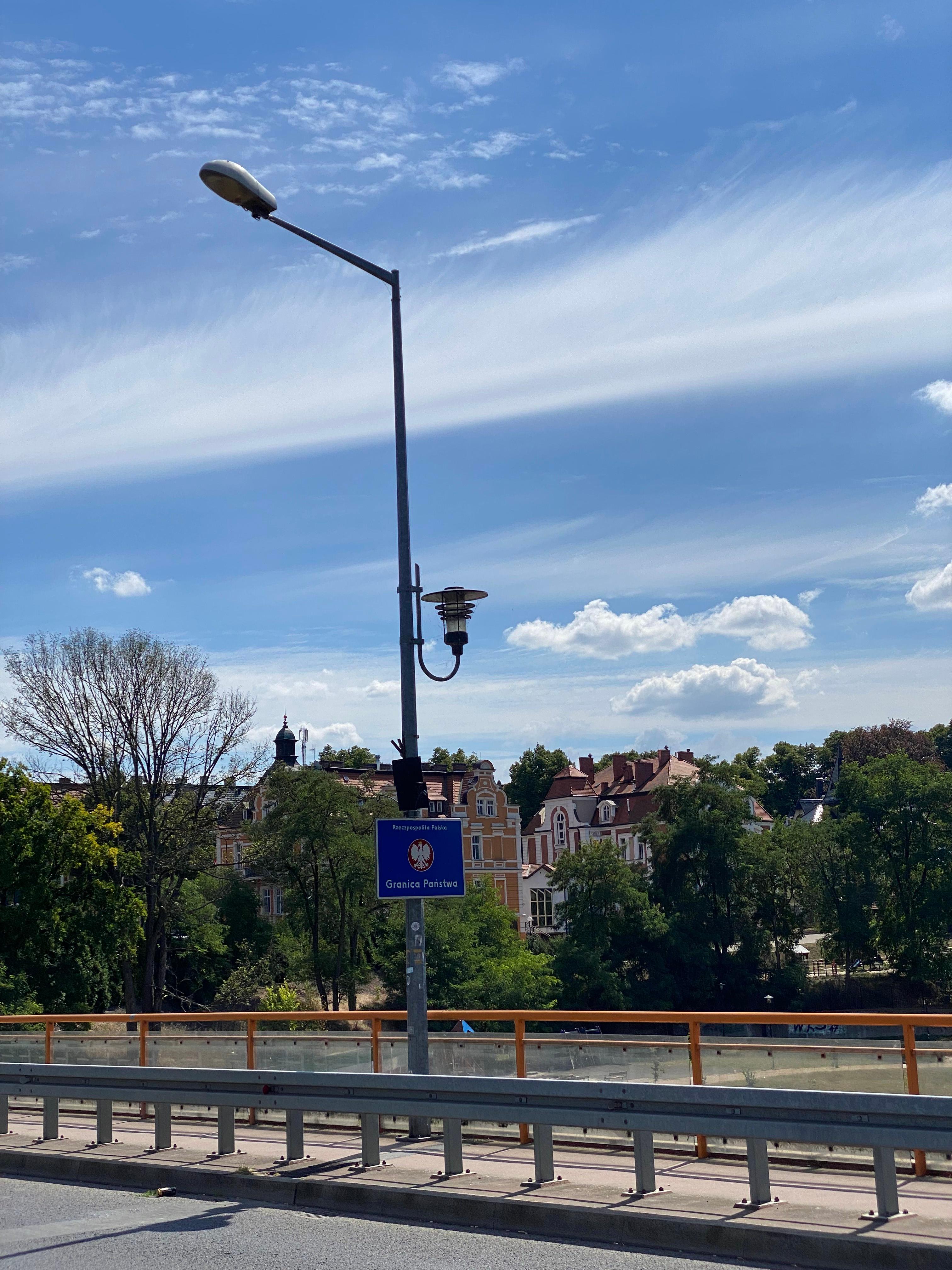 City road with lamp post and historic buildings