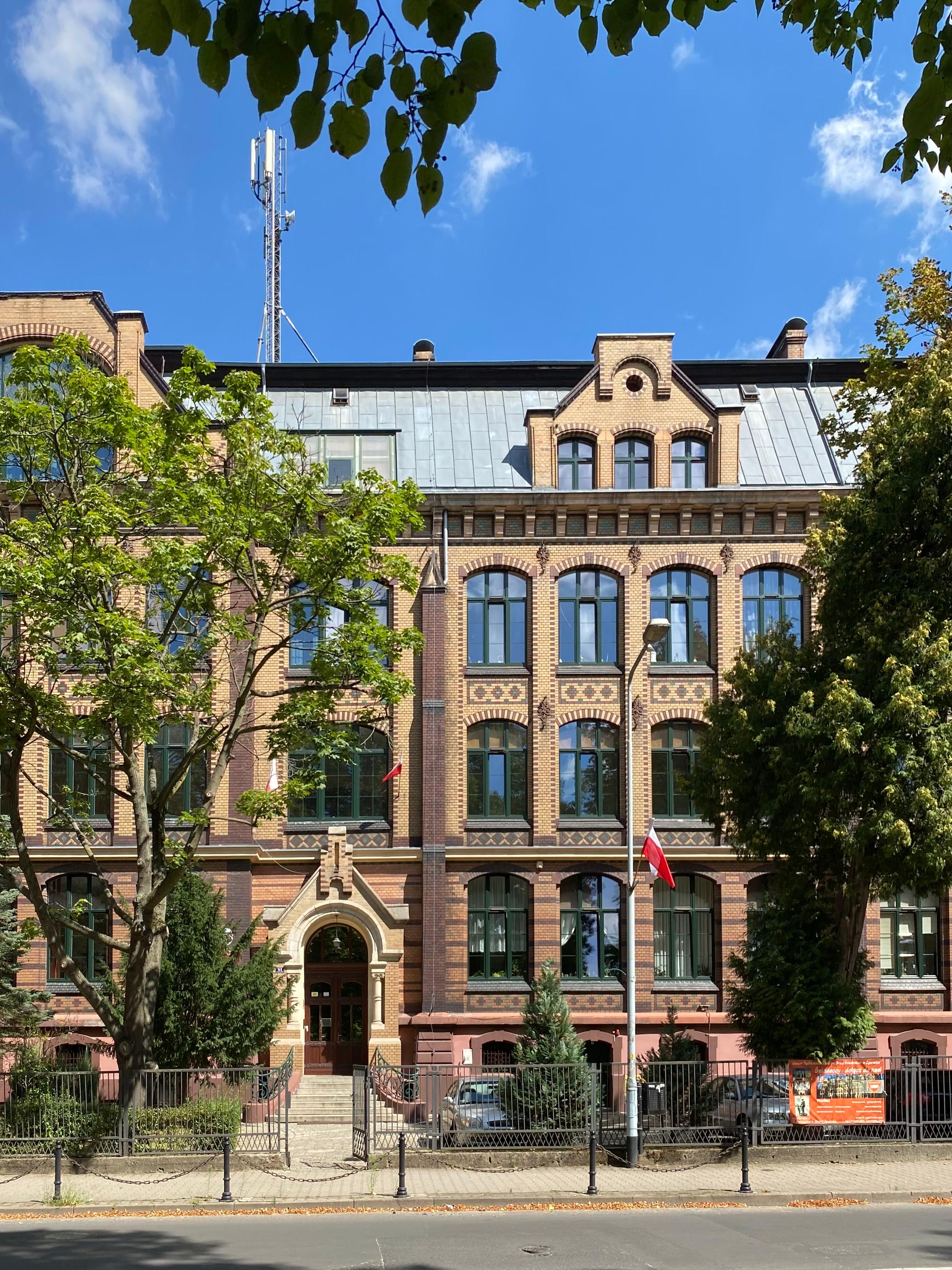 Neo-Gothic brick building facade with arched windows