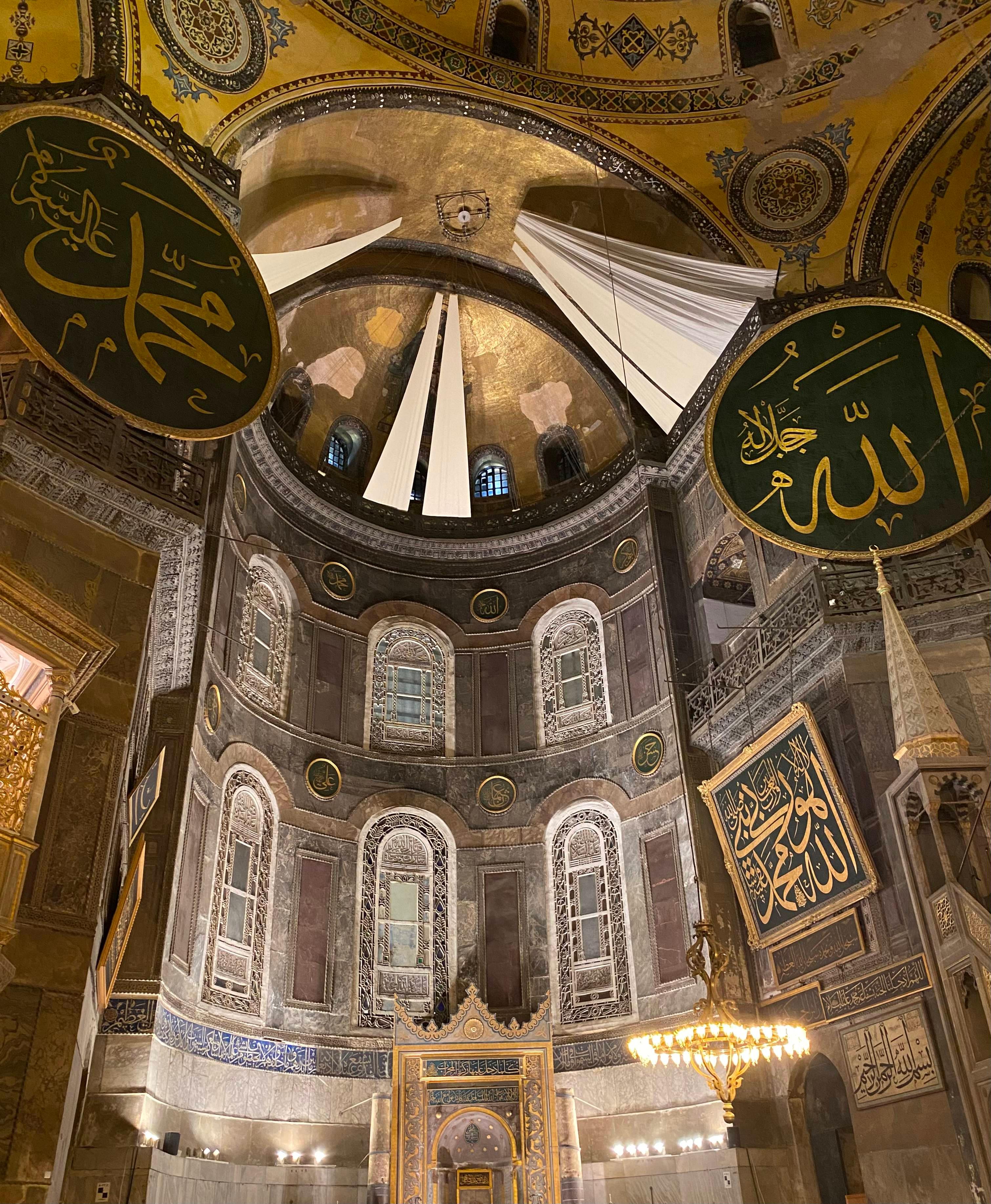 Hagia Sophia interior with golden mosaics and calligraphy medallions
